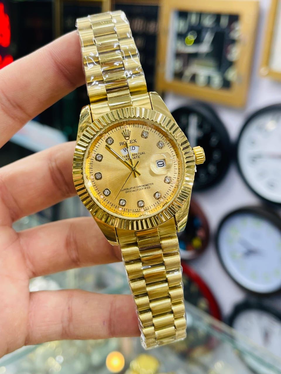 Rolex Day-Date premium Golden Dial